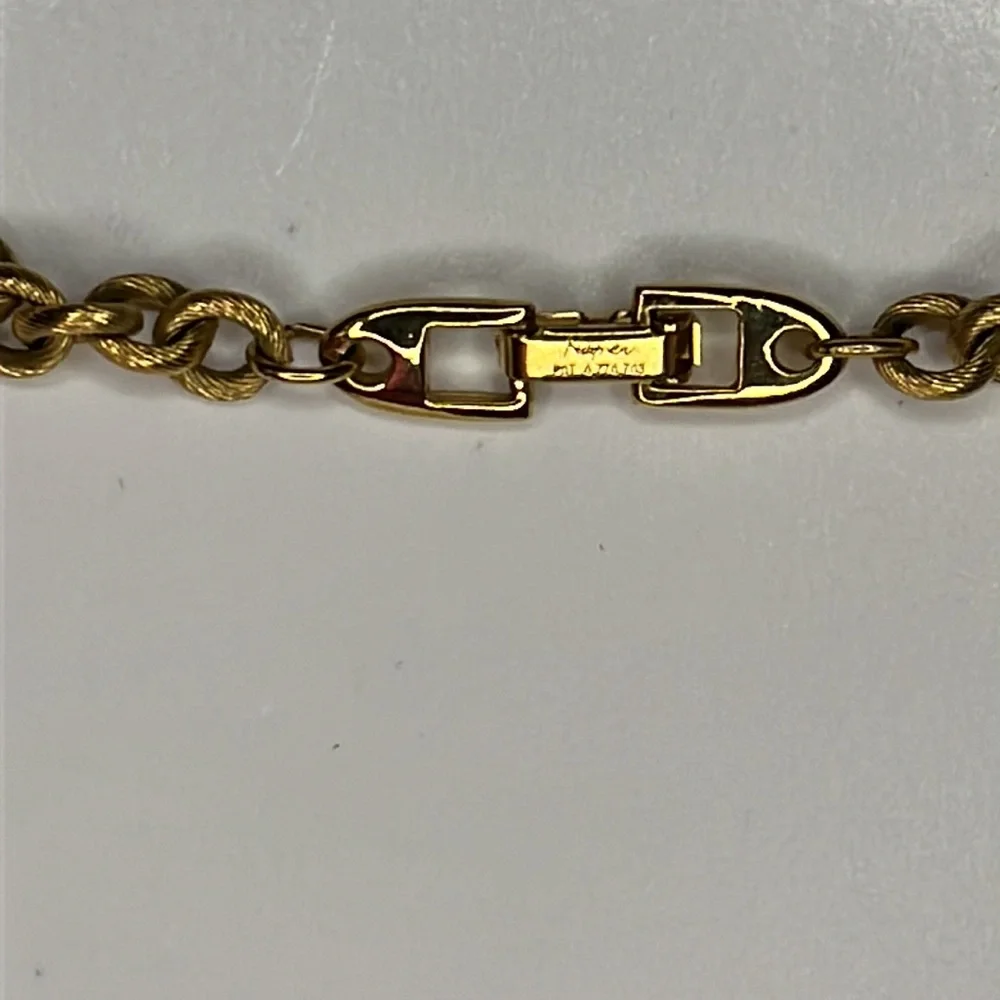 Napier single strand gold tone chain with faux pearls.